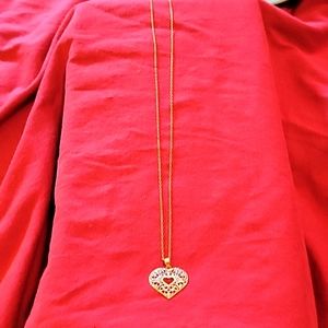 Gold chain stamped 1/20 12k. Heart pendant stamped 14 k